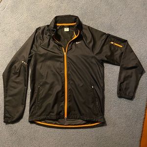 Black Nike athletic windbreaker